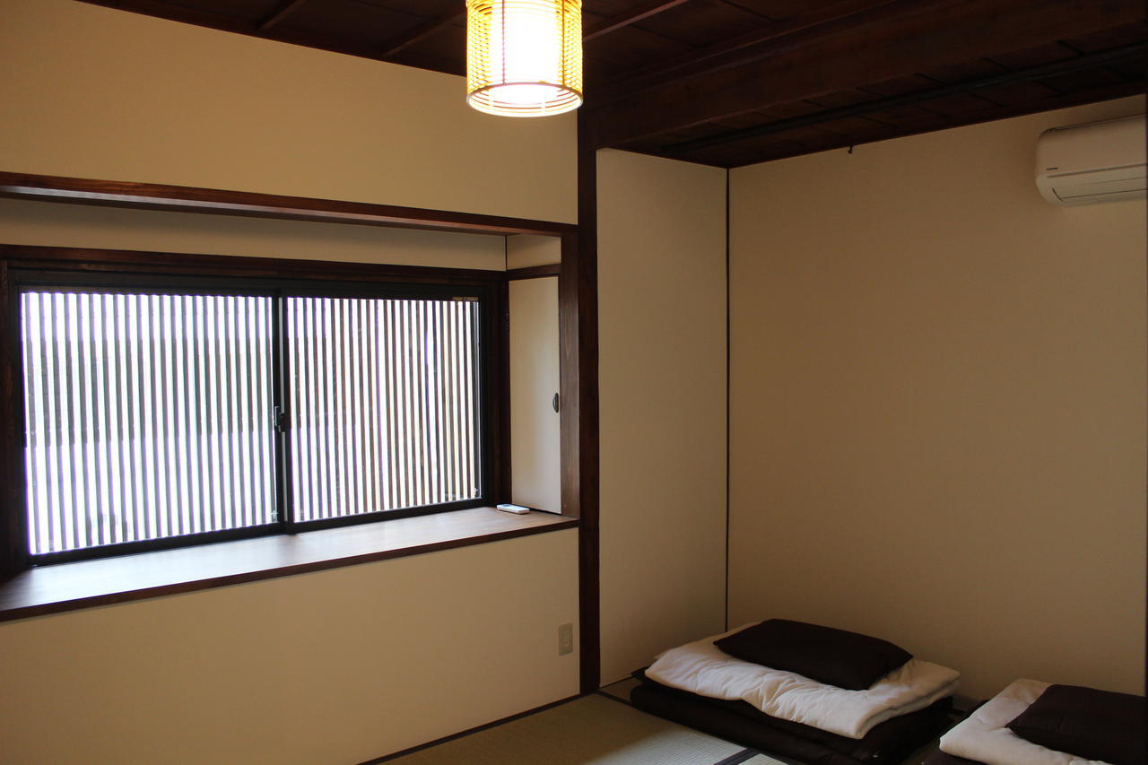 Tenma Itoya Guest House Osaka Værelse billede